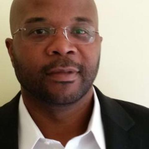Profile headshot photo of Gregory K Reed.