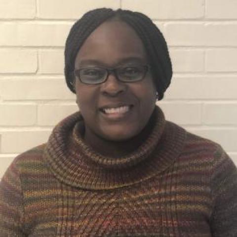 Profile headshot photo of Claudia Clara Mouamba.