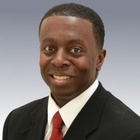 Profile headshot photo of Carlos Buskey.