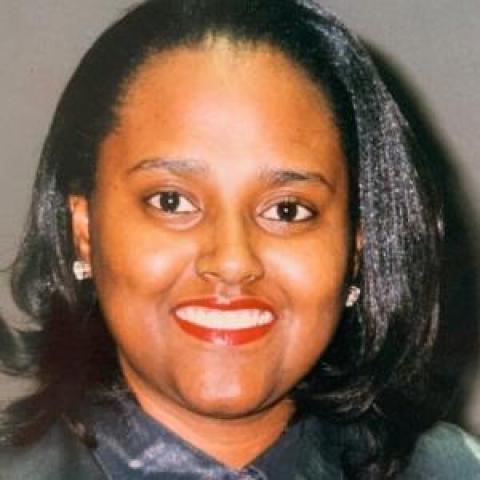 Profile headshot photo of Gloria E. Cain.