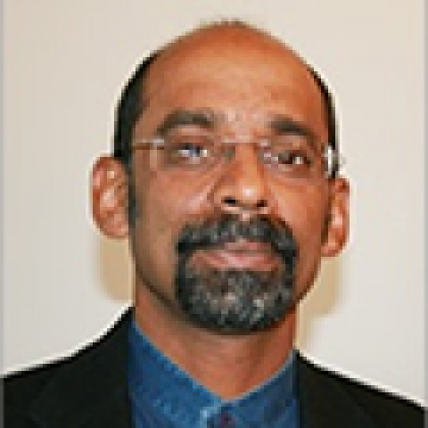 Profile headshot photo of John Tharakan.