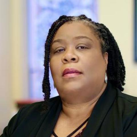 Profile headshot photo of Melanie Carter.