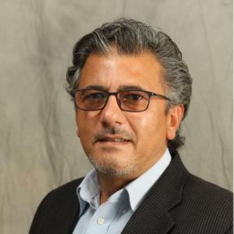 Profile headshot photo of Muneer Abbas.