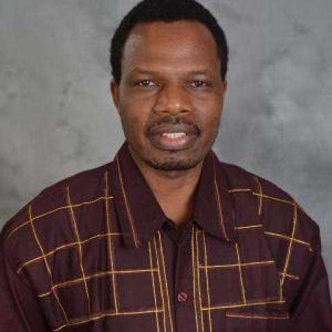 Profile headshot photo of Leonard Muaka.