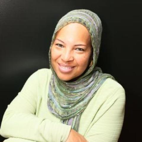 Profile headshot photo of Nisa Muhammad.
