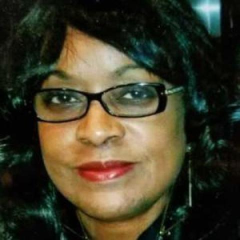 Profile headshot photo of Reba Brewington.