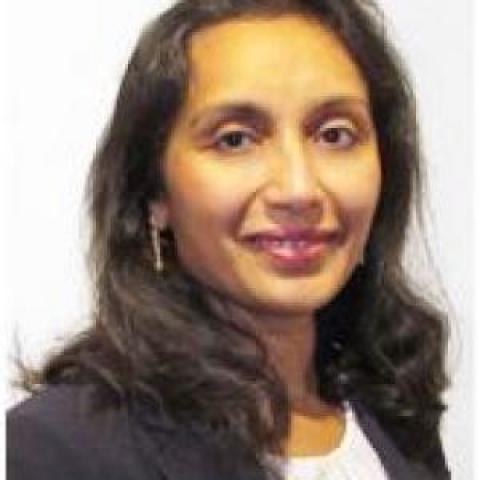 Profile headshot photo of Nea Maloo, FAIA, NOMA, LEED AP, ICC.