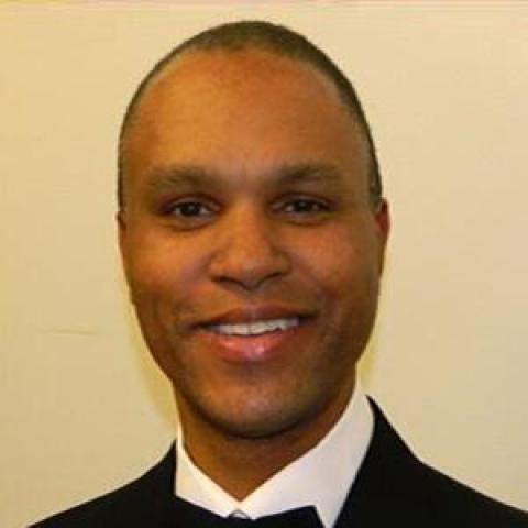 Profile headshot photo of Eric O. Poole.