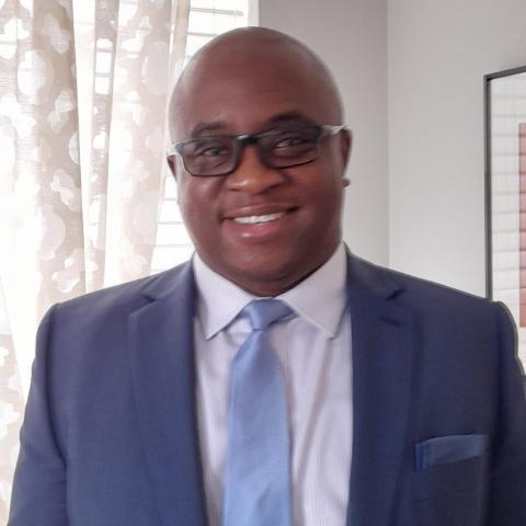 Profile headshot photo of Ike Uzuegbunam, Ph.D..