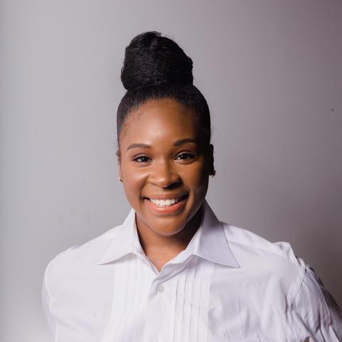 Profile headshot photo of Queade Dweh.