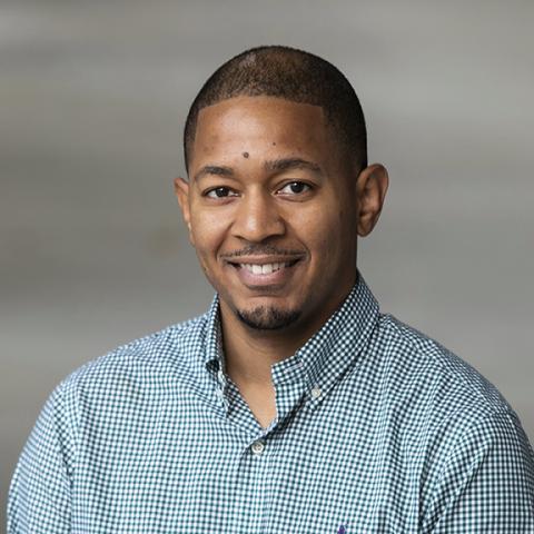 Profile headshot photo of Brandon T. Ash.