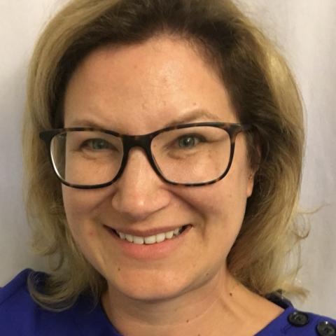 Profile headshot photo of Kelly Knickmeier-Cummings, PHD.