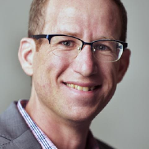 Profile headshot photo of Matthew Bruckner.