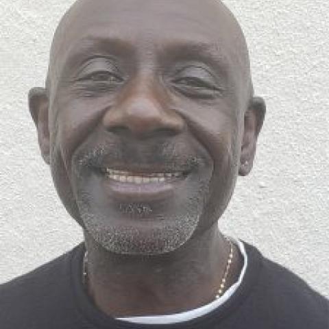 Profile headshot photo of Assane Konte.