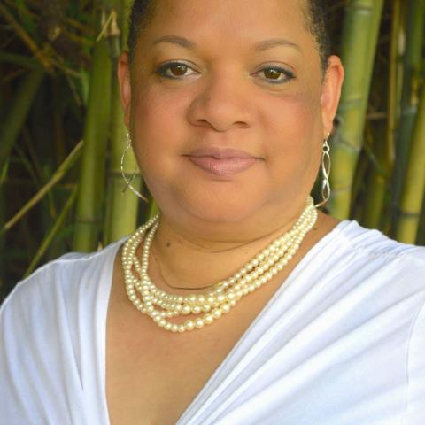 Profile headshot photo of Kim Bey.