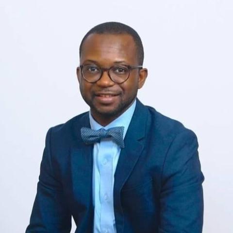 Profile headshot photo of Moses Bility.