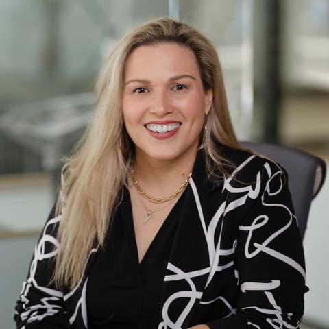 Profile headshot photo of Yiselle Santo Rivera, AIA, ACSA, LSSYB, NCARB, NOMA, SHRM-SCP.