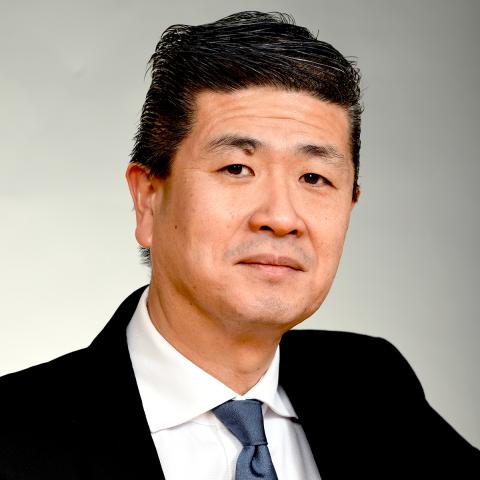 Profile headshot photo of John Ahn.