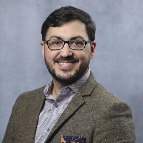 Profile headshot photo of Nicholas Rebold, PharmD, MPH, BCIDP, AAHIVP.