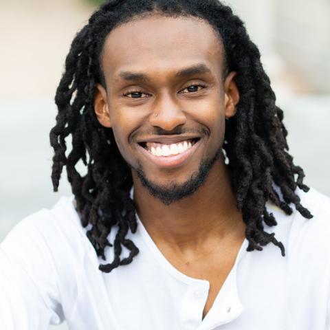 Profile headshot photo of Travis Xavier Brown.