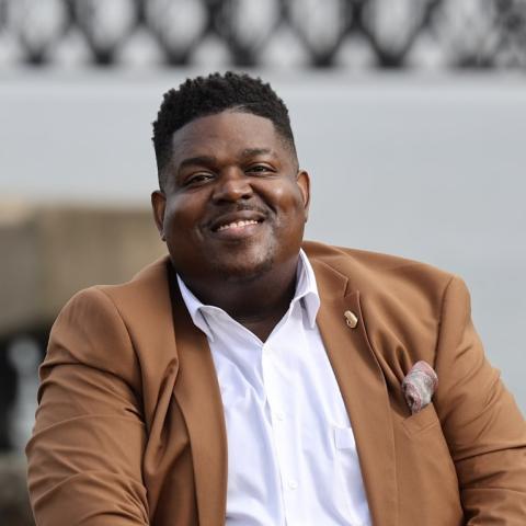 Profile headshot photo of Reginald Bowens, DMA.