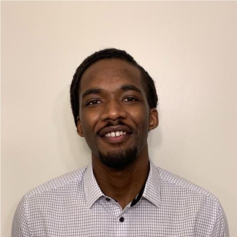 Profile headshot photo of Manoah Farmer.