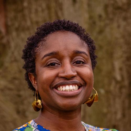 Photo of Monique Major is a blue, orange, and green dress. 