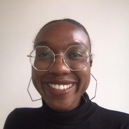 facial photograph of Patience wearing hexagonal earrings and Chloé frames