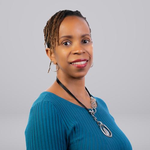 African-American woman with blue top and gray background