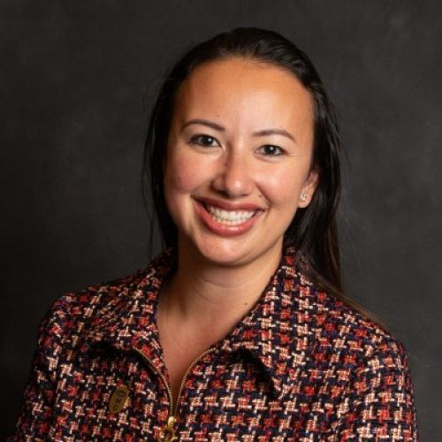 headshot of Katrina Chin Loy with a grey background