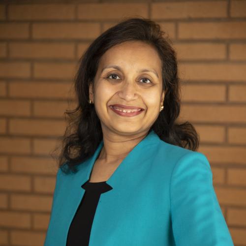 Headshot photo of Nea Maloo FAIA,NOMA, NCARB, LEED AP, ICC