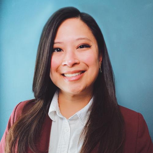 Woman with long hair red blazer and white blouse